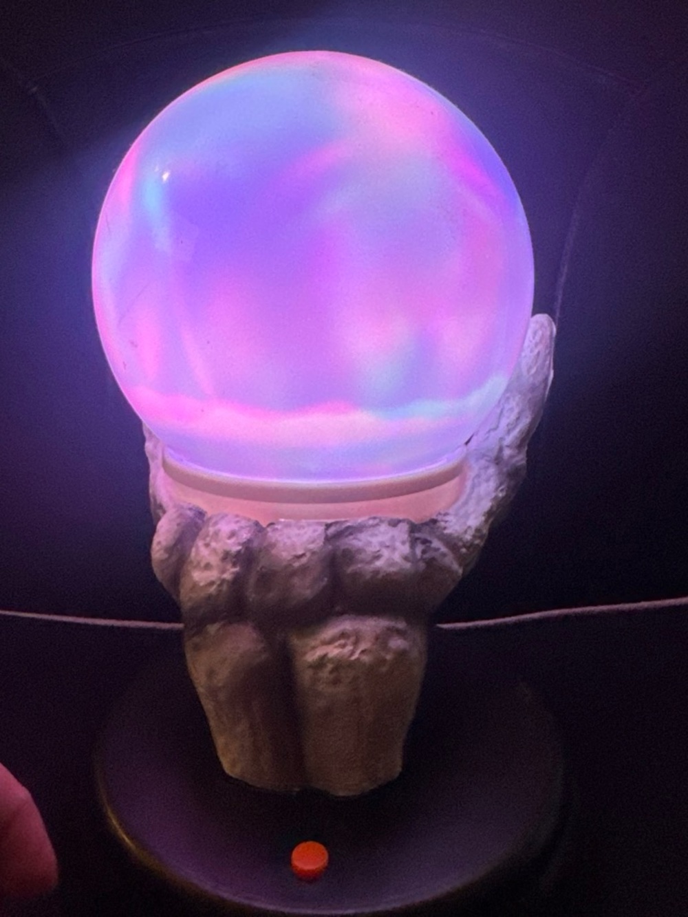 Halloween skeleton hand with magic ball